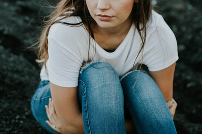 People wearing white round neckline t-shirts in shallow focus images
